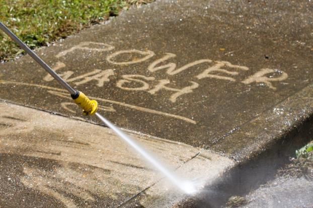 POWER WASHING An employee at Chicago Service Source Inc